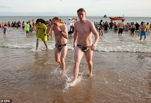 Hundreds of swimmers brave icy waters for traditional New Year’s Day dip in Whitley Bay, North Tyneside