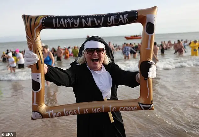 Hundreds of swimmers brave icy waters for traditional New Year’s Day dip in Whitley Bay, North Tyneside