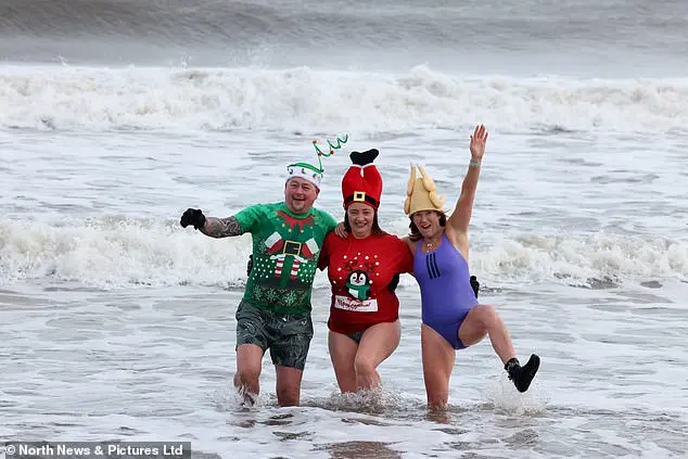 Hundreds of swimmers brave icy waters for traditional New Year’s Day dip in Whitley Bay, North Tyneside