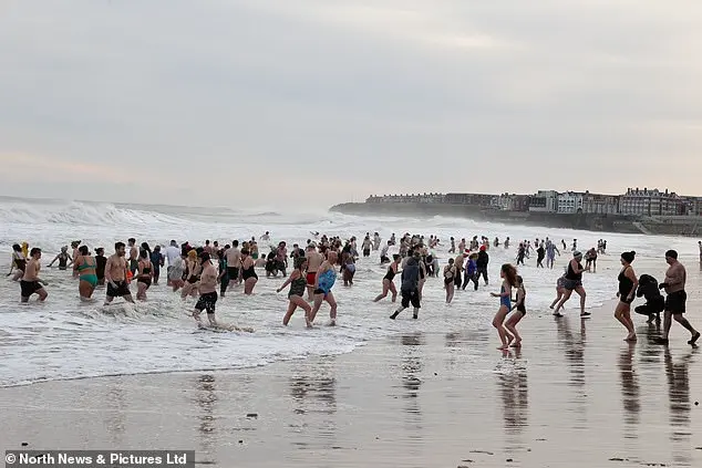 Hundreds of swimmers brave icy waters for traditional New Year’s Day dip in Whitley Bay, North Tyneside