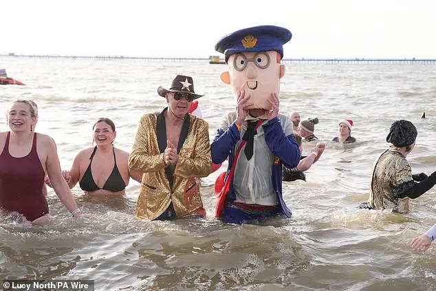 Hundreds of swimmers brave icy waters for traditional New Year’s Day dip in Whitley Bay, North Tyneside