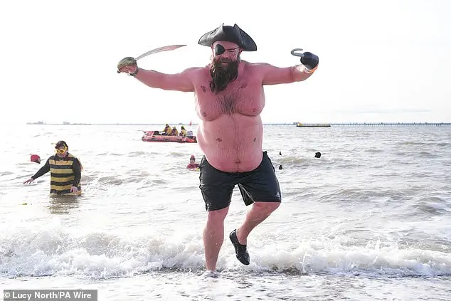 Hundreds of swimmers brave icy waters for traditional New Year’s Day dip in Whitley Bay, North Tyneside