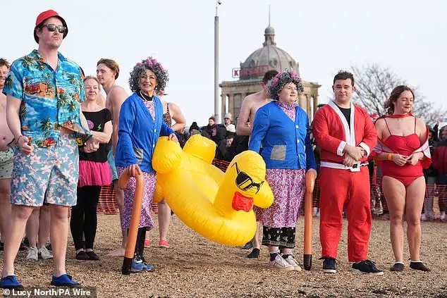 Hundreds of swimmers brave icy waters for traditional New Year’s Day dip in Whitley Bay, North Tyneside
