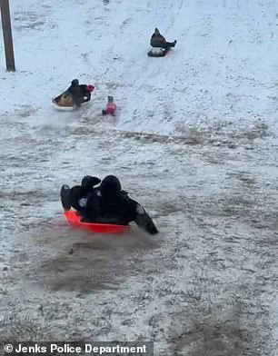 Oklahoma Police Officer's Accidental Sled Incident Highlights Public Safety Concerns Ahead of Winter Storm