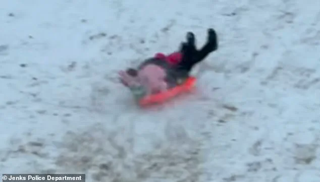 Oklahoma Police Officer's Accidental Sled Incident Highlights Public Safety Concerns Ahead of Winter Storm