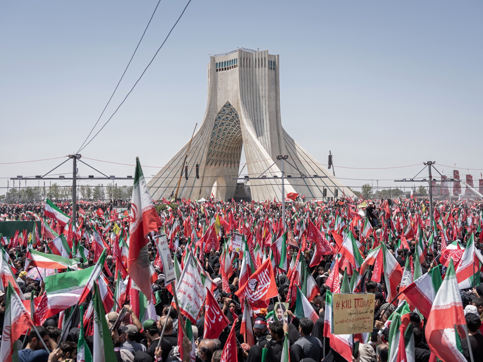 Millions of Iranians gather in Qom for Ayatollah Khamenei's procession.